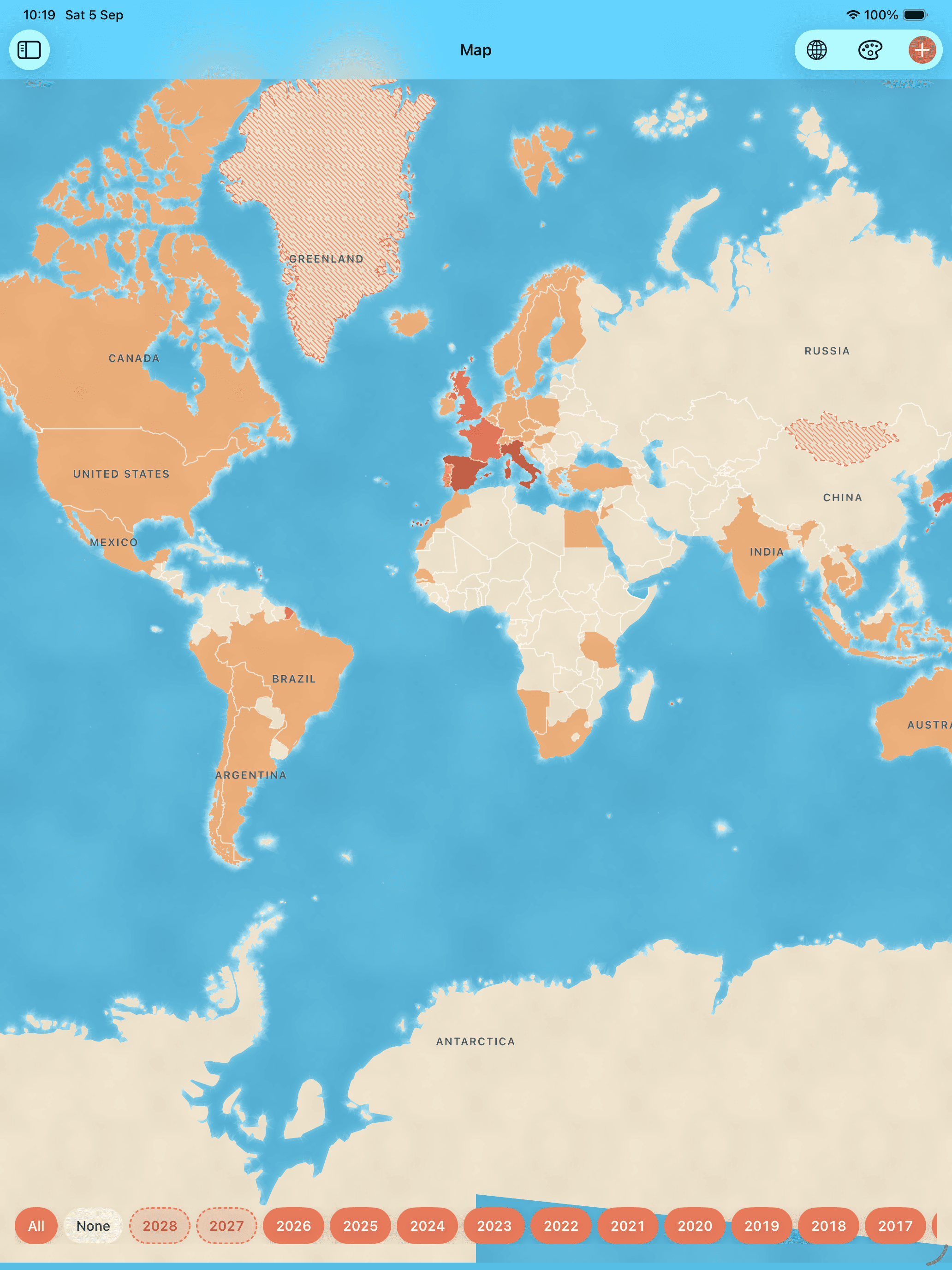 A world map on warm paper with the Americas, most of Europe, southern Africa and south-east Asia filled coral. Spain, France, Italy and Great Britain are the deepest of them; Greenland and Mongolia are hatched, still only planned.