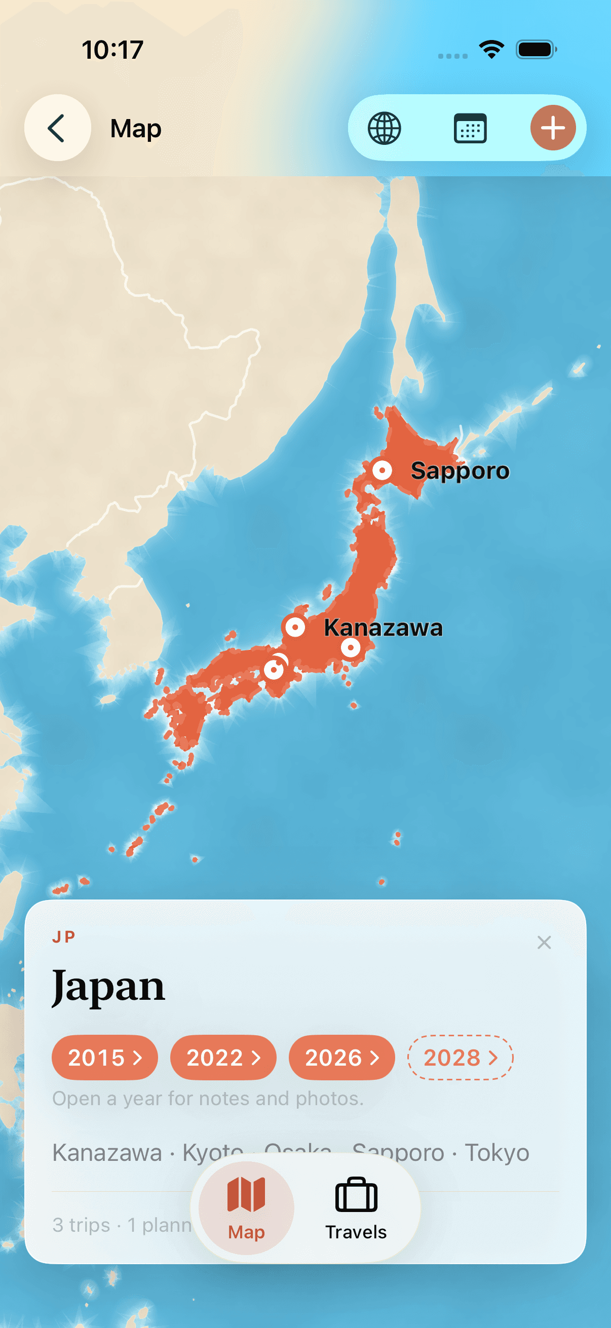 Japan filled coral, with pins on Sapporo, Kanazawa, Kyoto, Osaka and Tokyo, and a card listing 2015, 2022 and 2026 with 2028 still planned.